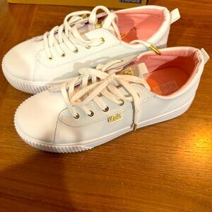 All white keds triple step
